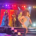 images from Pride Weekend 2026: people walking through booths at festival, Regina Sapphire in blue gown at drag show, Pride yoga in the park, Borad Band performing in gazebo, Shenita Lyfe in golden gown at drag show, Vixen in park drag show, Firefly performing, large Pride flag, Amber Skyy at drag show